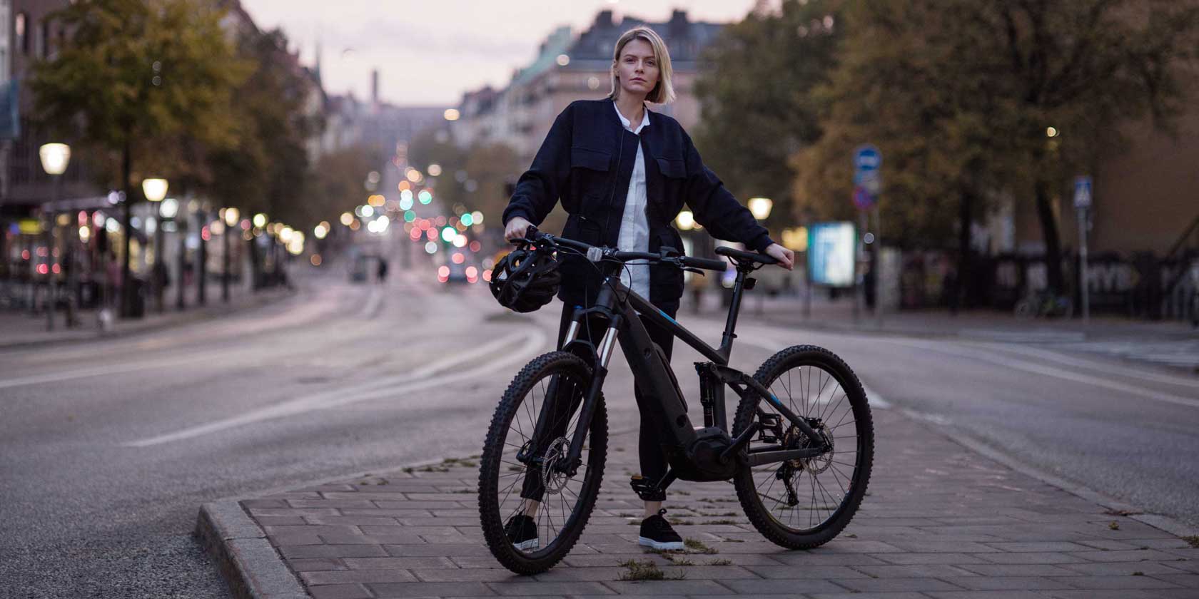 A young woman with a bike in Stockholm city